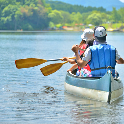 a family of three canoeing